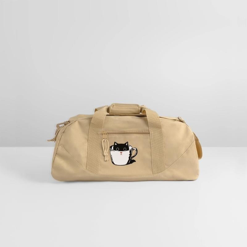 Black kitten with red nose hiding in a cup