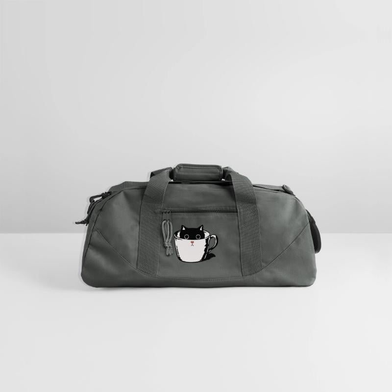 Black kitten with red nose hiding in a cup