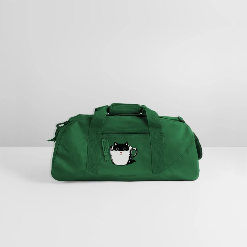 Black kitten with red nose hiding in a cup